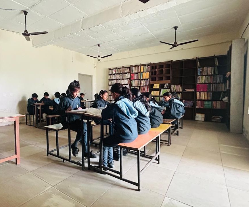 Students studying together in Library